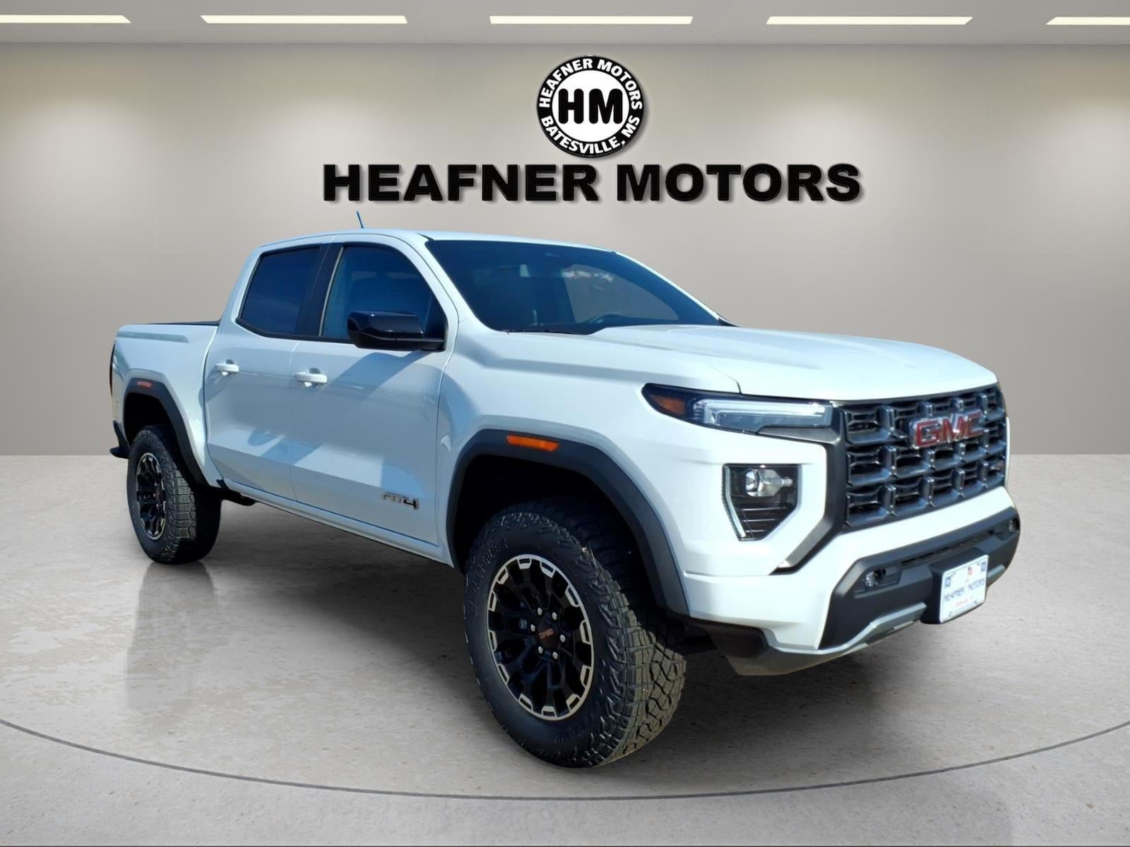 2026 GMC Canyon AT4 in Summit White — front three-quarter view