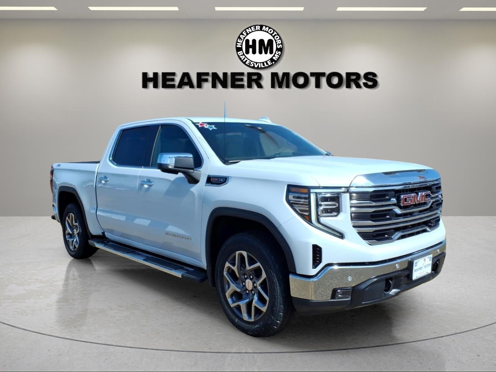 2026 GMC Sierra 1500 SLT in Glacier White Tricoat — front three-quarter view