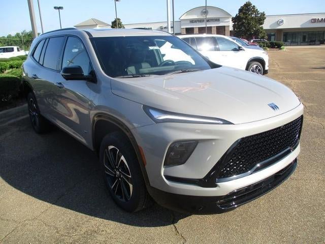 2026 Buick Enclave Sport Touring in Stone Metallic — front three-quarter view