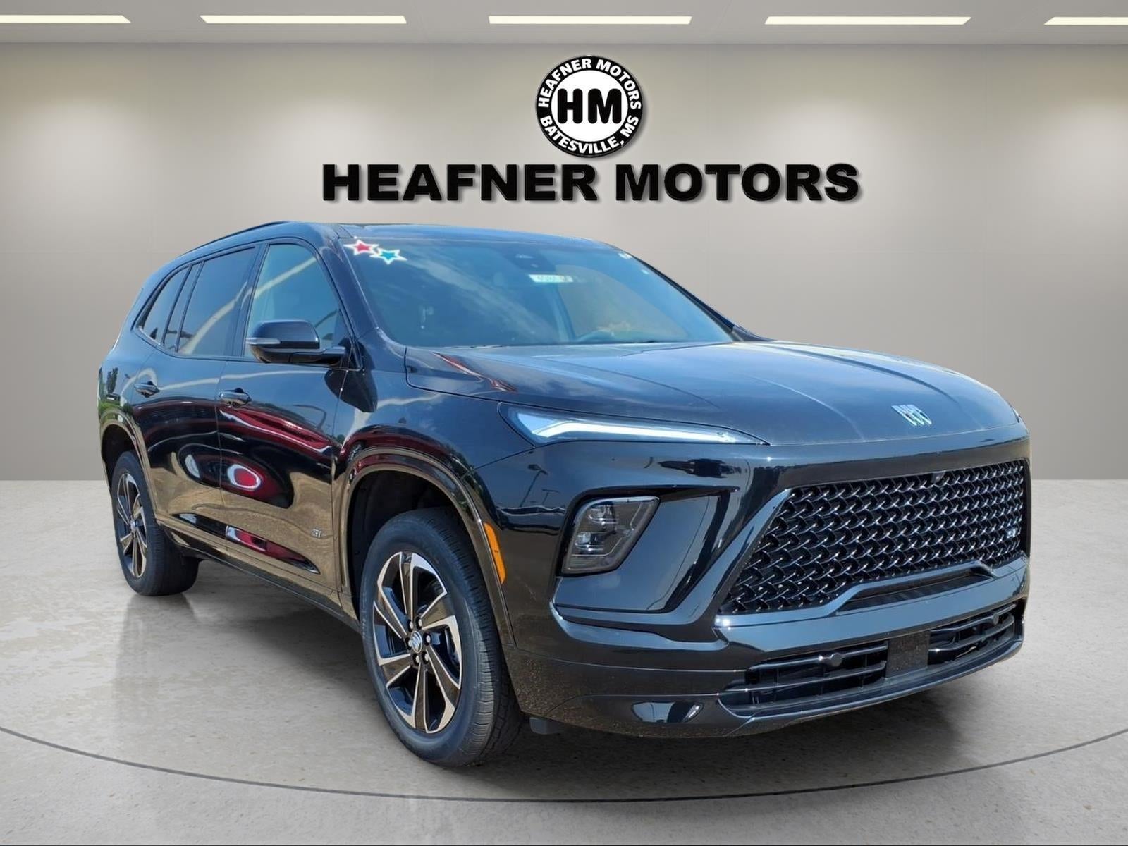 2026 Buick Enclave Sport Touring in Ebony Twilight Metallic — front three-quarter view