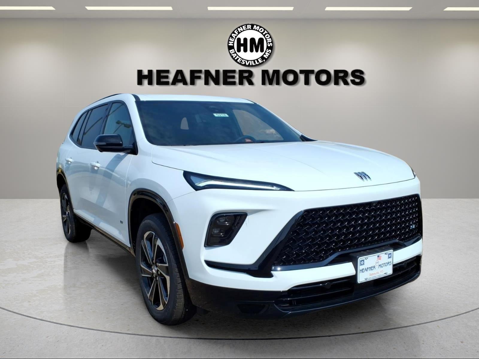 2026 Buick Enclave Sport Touring in Summit White — front three-quarter view
