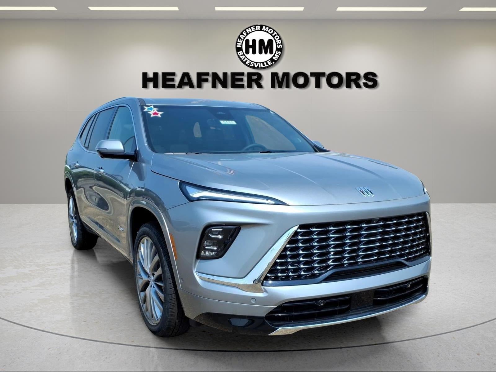 2026 Buick Enclave Avenir in Moonstone Gray Metallic — front three-quarter view